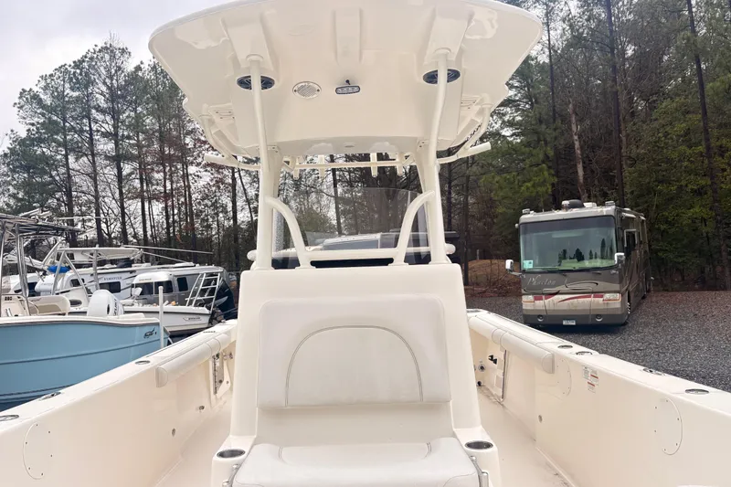 Slide: The Image of 2023 Sea Born LX26 Center Console boat in a wooded outdoor setting. - 17