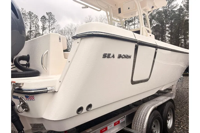 Slide: The Image of 2023 Sea Born LX26 Center Console boat on trailer, side view. - 19