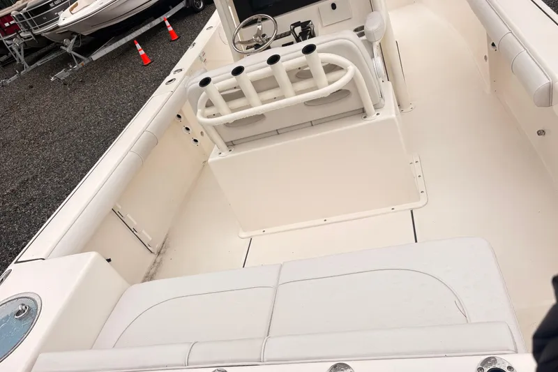 Slide: The Image of 2023 Sea Born LX26 Center Console boat interior with seating and steering wheel. - 5