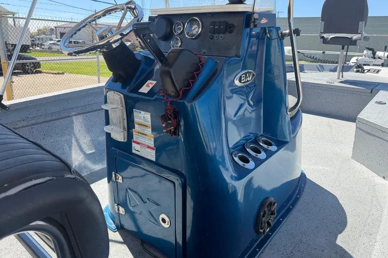 Slide: The Image of 2015 Xpress H22B Bay boat console with steering wheel and control panel. - 10