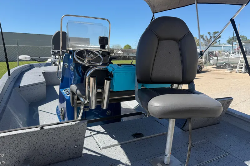 Slide: The Image of 2015 Xpress H22B Bay boat interior with steering console and seating. - 13