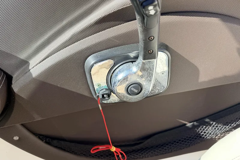 Slide: The Image of Throttle control lever on a 2016 Cobalt R7 boat interior. - 10