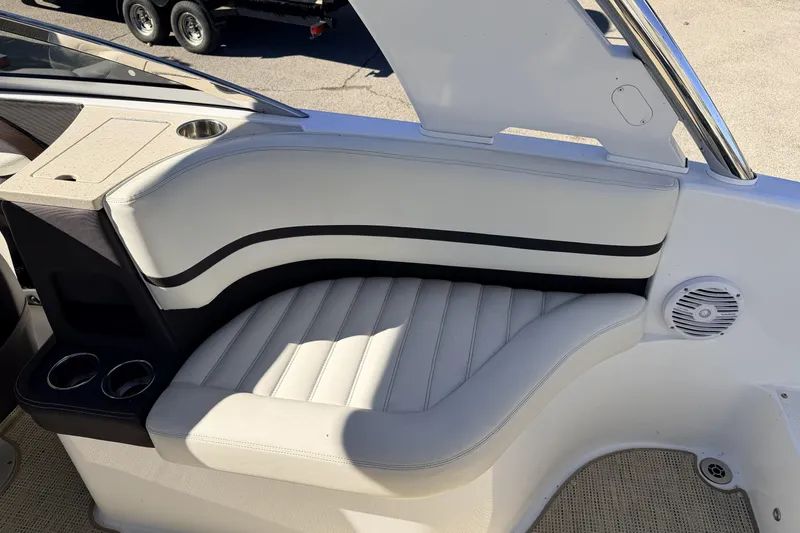 Slide: The Image of Luxurious seating area in a 2016 Cobalt R7 boat with cup holders and speaker. - 15