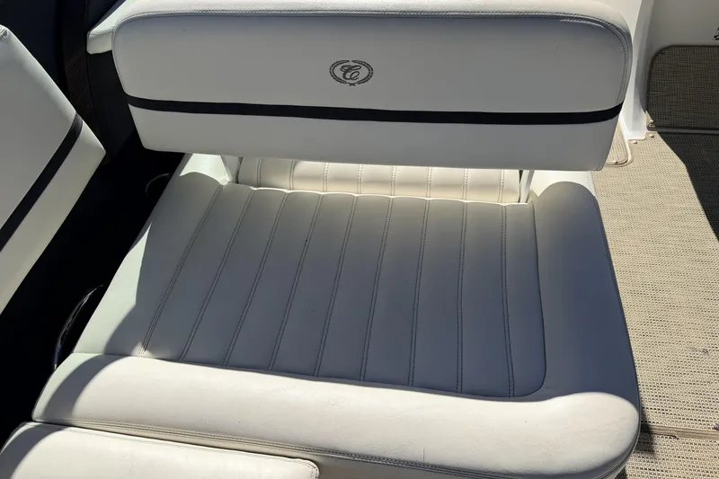 Slide: The Image of White leather seat in a 2016 Cobalt R7 boat, featuring elegant stitching. - 16