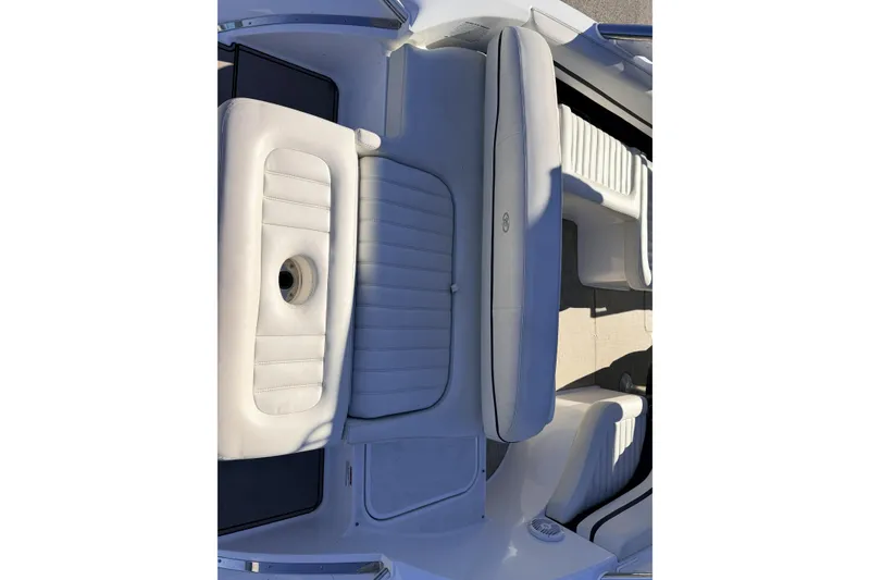 Slide: The Image of 2016 Cobalt R7 boat interior with white cushioned seating and sleek design. - 21
