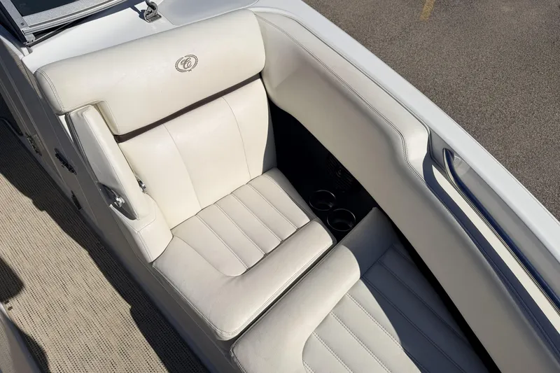 Slide: The Image of 2016 Cobalt R7 boat interior with white leather seating and cup holders. - 5