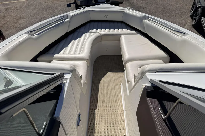 Slide: The Image of Interior of a 2016 Cobalt R7 boat with white seating and carpeted floor. - 7