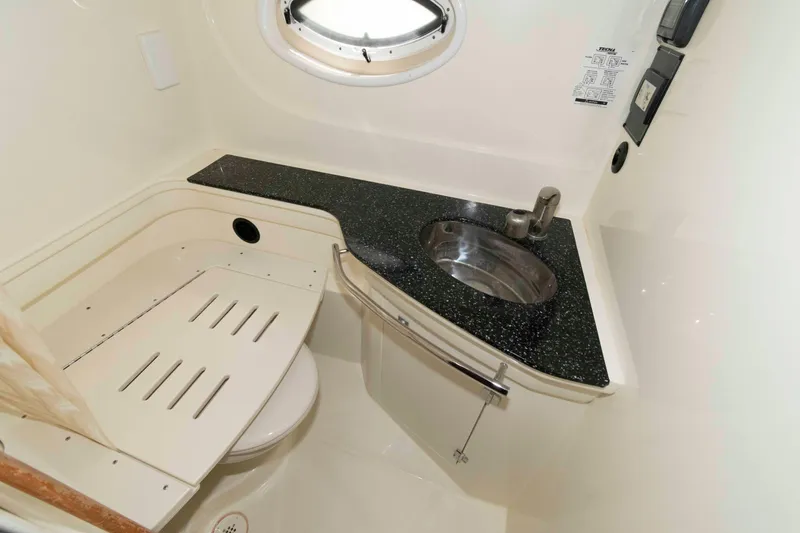 Slide: The Image of 2015 Monterey 355 Sport Yacht bathroom with sleek sink and modern fixtures. - 14