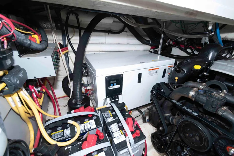 Slide: The Image of Engine room of 2015 Monterey 355 Sport Yacht with batteries and generator. - 16