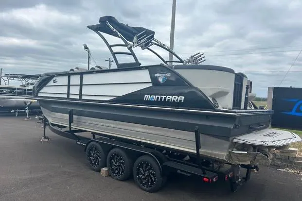 Slide: The Image of 2022 Montara 25 Surf Boss 2.0 CW boat on trailer, parked outdoors. - 3