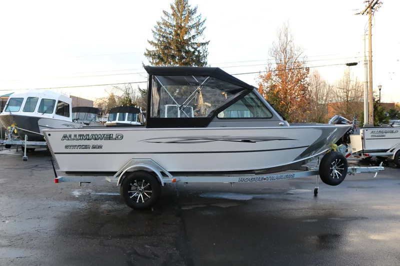 The Image of 2026 Alumaweld Stryker 202 boat on trailer, parked outdoors. - 1