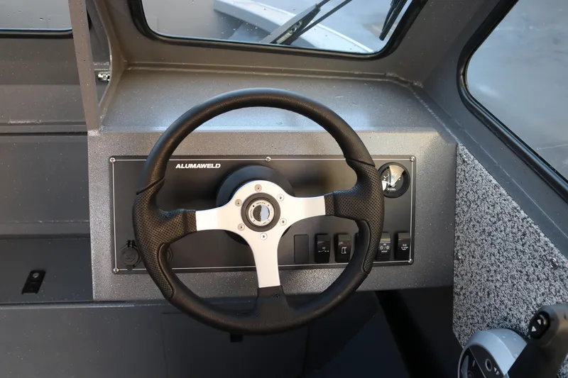Slide: The Image of Steering wheel of 2026 Alumaweld Stryker 202 boat, featuring modern dashboard controls. - 10