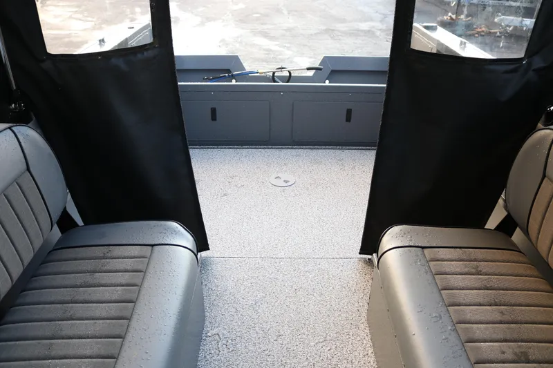 Slide: The Image of Interior view of 2026 Alumaweld Stryker 202 boat, featuring seating and deck area. - 13