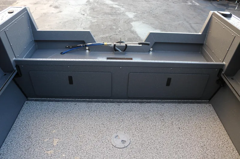 Slide: The Image of 2026 Alumaweld Stryker 202 boat interior with storage compartments and textured flooring. - 14
