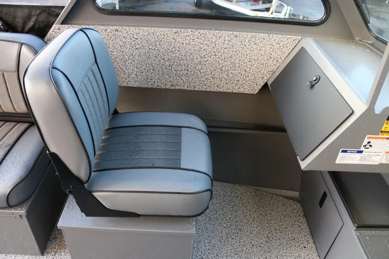 Slide: The Image of Interior of 2026 Alumaweld Stryker 202 boat with gray seating and storage compartment. - 16