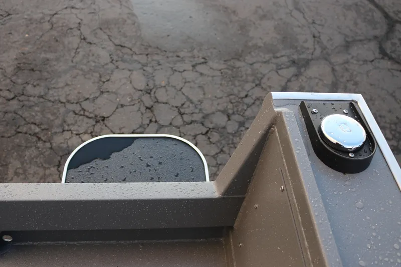 Slide: The Image of 2026 Alumaweld Stryker 202 boat detail with raindrops on metal surface. - 21