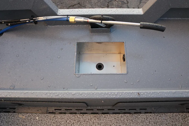 Slide: The Image of 2026 Alumaweld Stryker 202 boat deck with storage compartment and hose. - 22