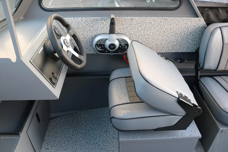 Slide: The Image of 2026 Alumaweld Stryker 202 boat interior with steering wheel and seating. - 24