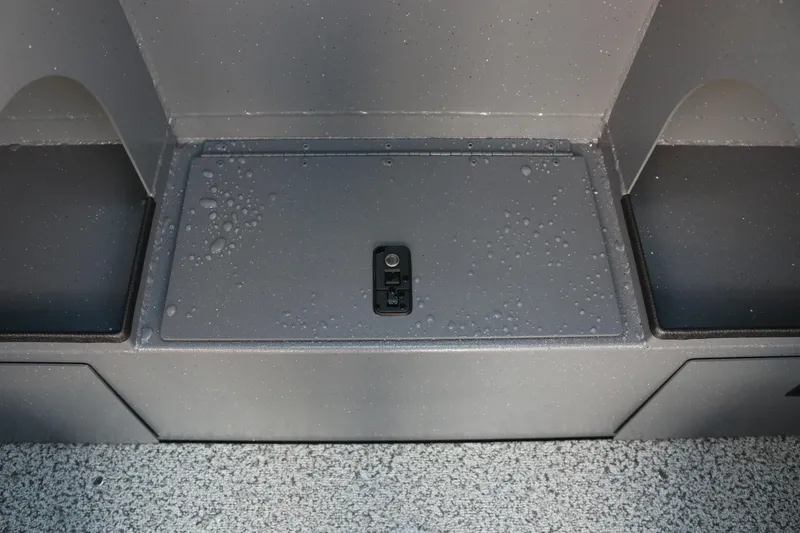 Slide: The Image of 2026 Alumaweld Stryker 202 boat storage compartment with water droplets. - 25