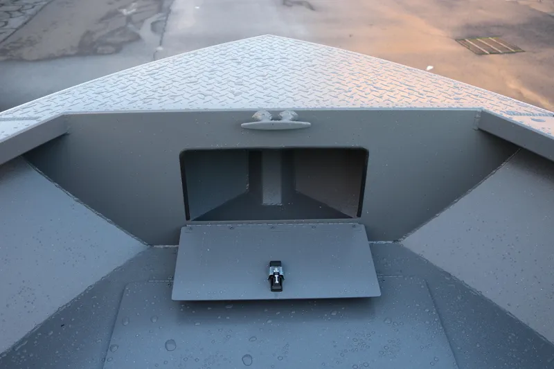 Slide: The Image of Alumaweld Stryker 2026 boat bow with storage compartment and textured surface. - 31