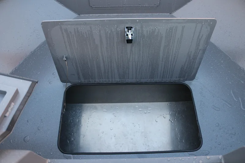 Slide: The Image of Open storage compartment of 2026 Alumaweld Stryker 202 boat, showing interior details. - 33