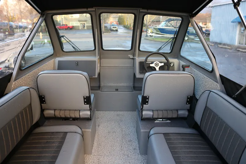 Slide: The Image of 2026 Alumaweld Stryker 202 boat interior with seating and steering wheel. - 8