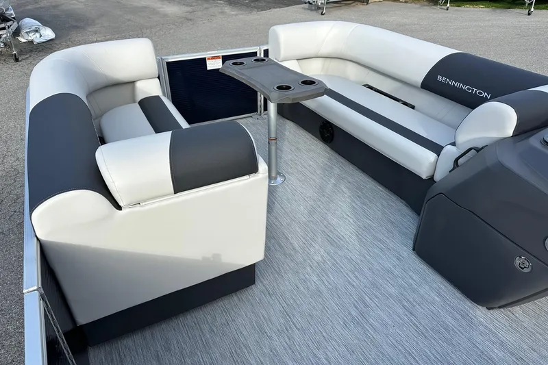 Slide: The Image of 2026 Bennington 22 SSB SwingBack interior with seating and table, featuring Yamaha 90 Hp engine. - 12