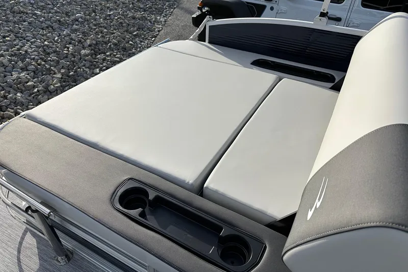Slide: The Image of 2026 Bennington 22 SSB SwingBack boat seating with cup holders, showcasing luxury design. - 21