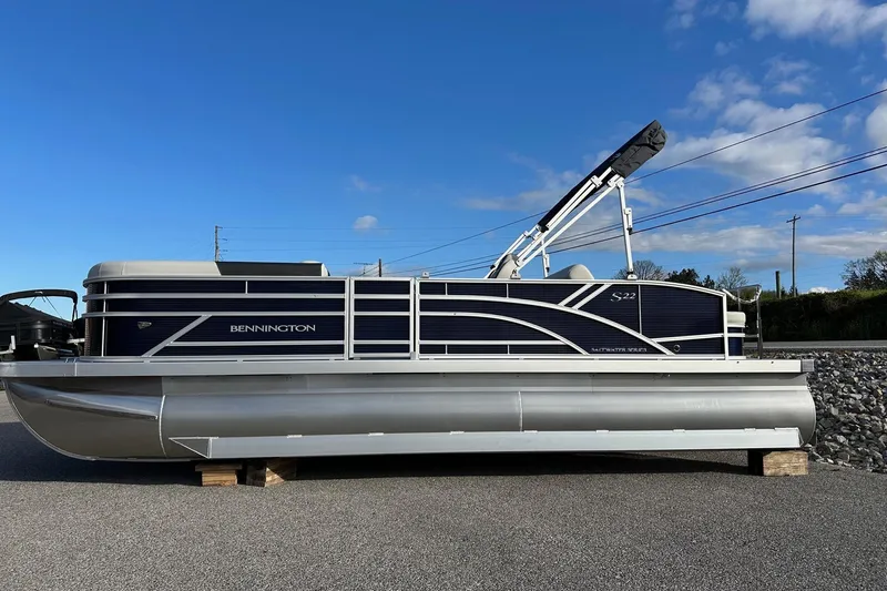 Slide: The Image of 2026 Bennington 22 SSB SwingBack pontoon boat with Yamaha 90 Hp engine, side view. - 26