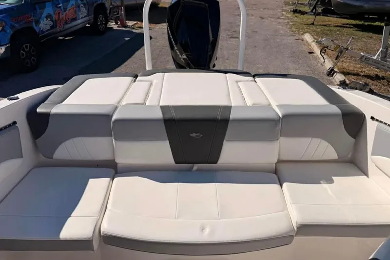 Slide: The Image of 2022 Chaparral 21 SSi OB boat interior with cushioned seating and sleek design. - 13