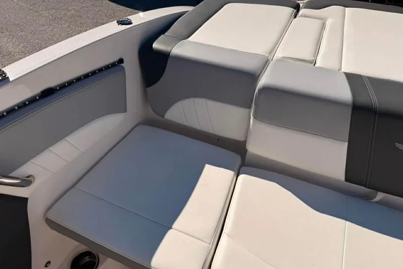 Slide: The Image of 2022 Chaparral 21 SSi OB boat interior with gray and white seating. - 3