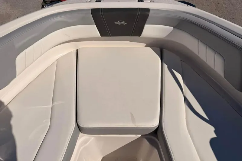 Slide: The Image of 2022 Chaparral 21 SSi OB boat interior with cushioned seating. - 4