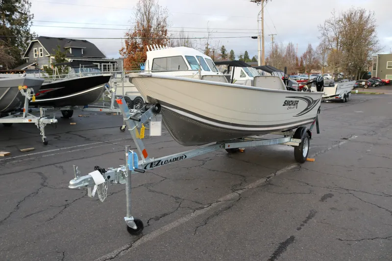 Slide: The Image of 2026 Smoker Craft Alaskan 15 boat on trailer in parking lot. - 5