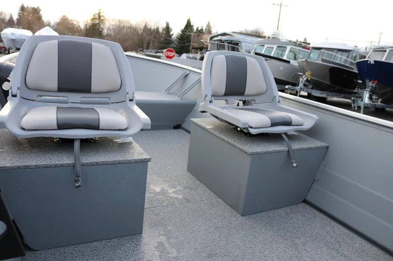 Slide: The Image of 2026 Smoker Craft Alaskan 15 boat interior with two cushioned seats. - 7