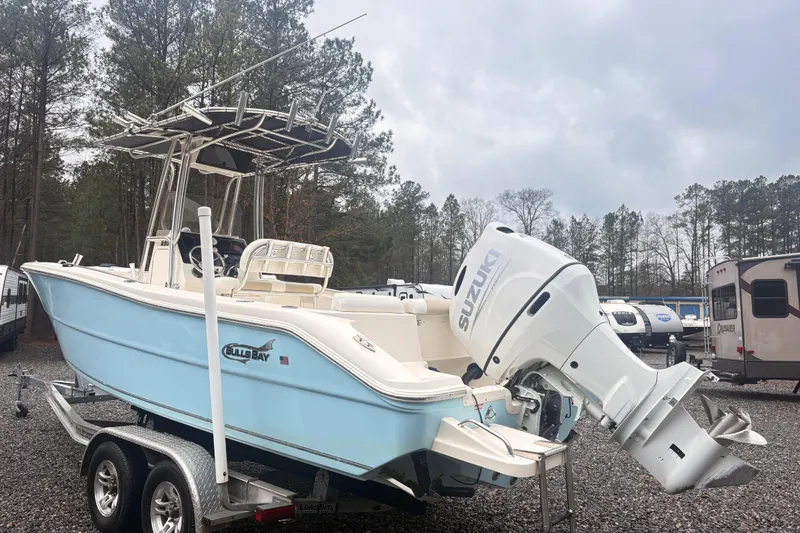 Slide: The Image of 2022 Bulls Bay 230 Center Console boat with Suzuki engine on trailer. - 1