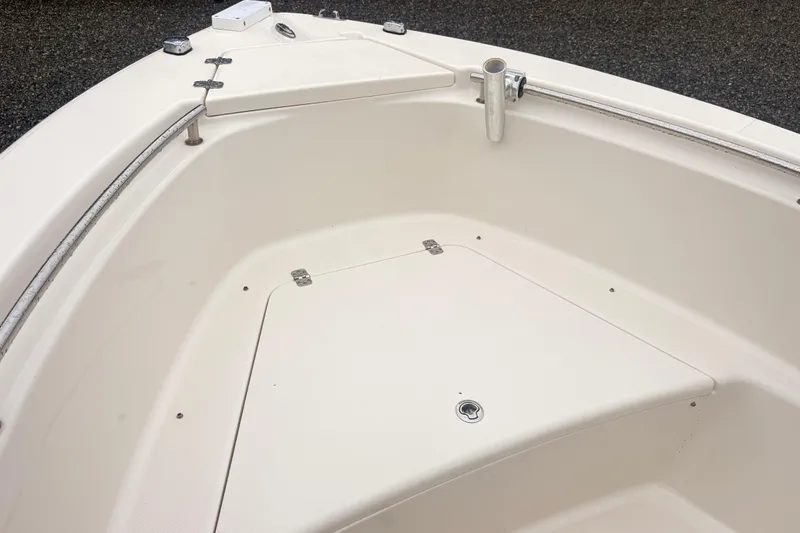 Slide: The Image of 2022 Bulls Bay 230 Center Console boat deck with storage compartment and rod holder. - 13