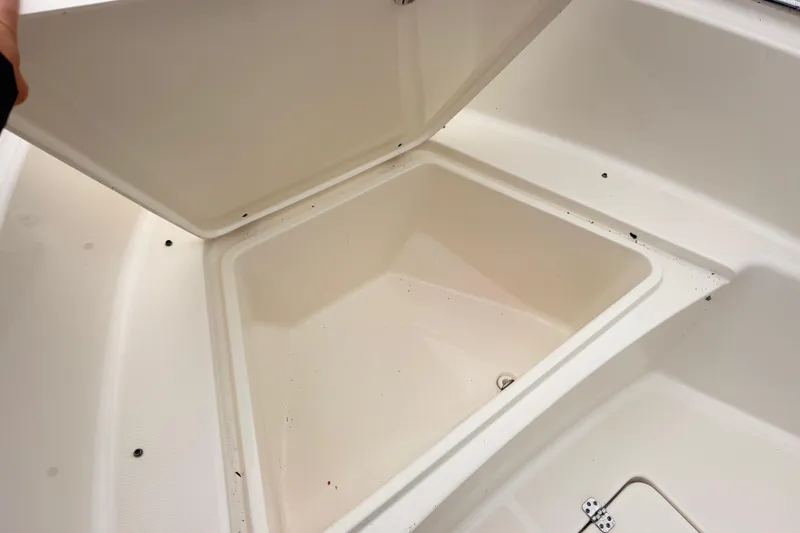 Slide: The Image of Open storage compartment on a 2022 Bulls Bay 230 Center Console boat. - 14