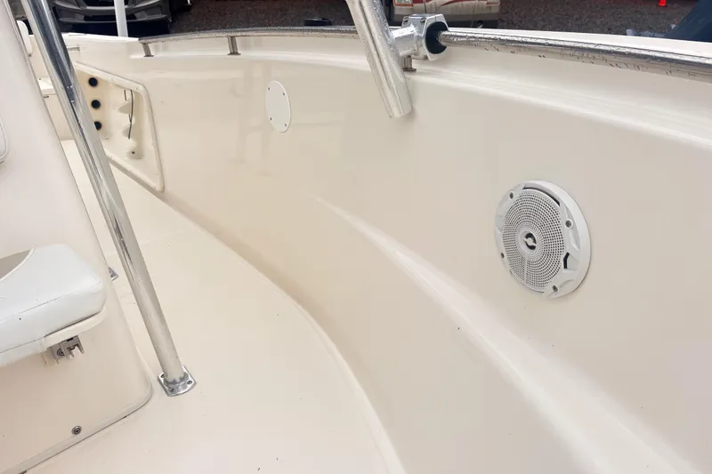 Slide: The Image of 2022 Bulls Bay 230 Center Console boat interior with speaker and railing. - 15