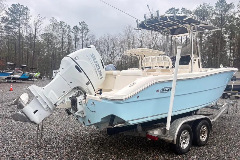 Slide: The Image of 2022 Bulls Bay 230 Center Console boat on trailer with Suzuki outboard motor. - 2