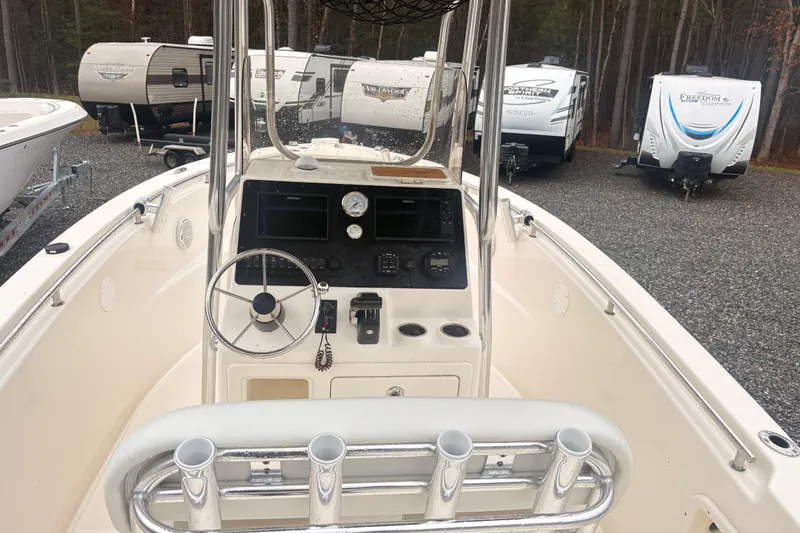 Slide: The Image of 2022 Bulls Bay 230 Center Console boat interior with steering wheel and control panel. - 5