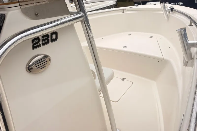 Slide: The Image of 2022 Bulls Bay 230 Center Console boat interior with seating and railing. - 9