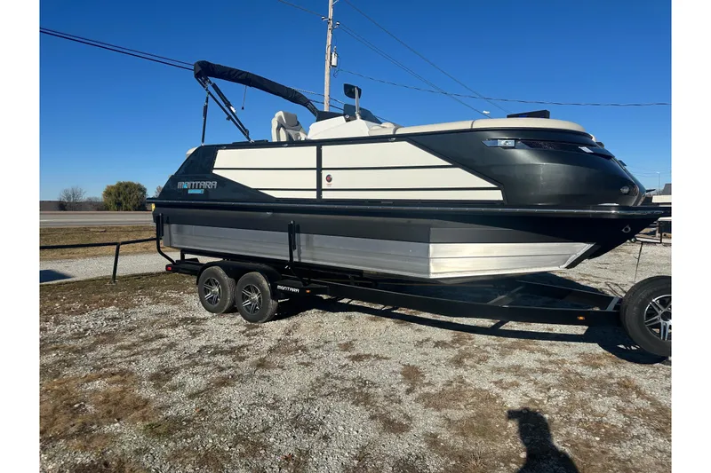 The Image of 2024 Montara 23 Surf Boss 2.0 CW boat on trailer, parked outdoors. - 0