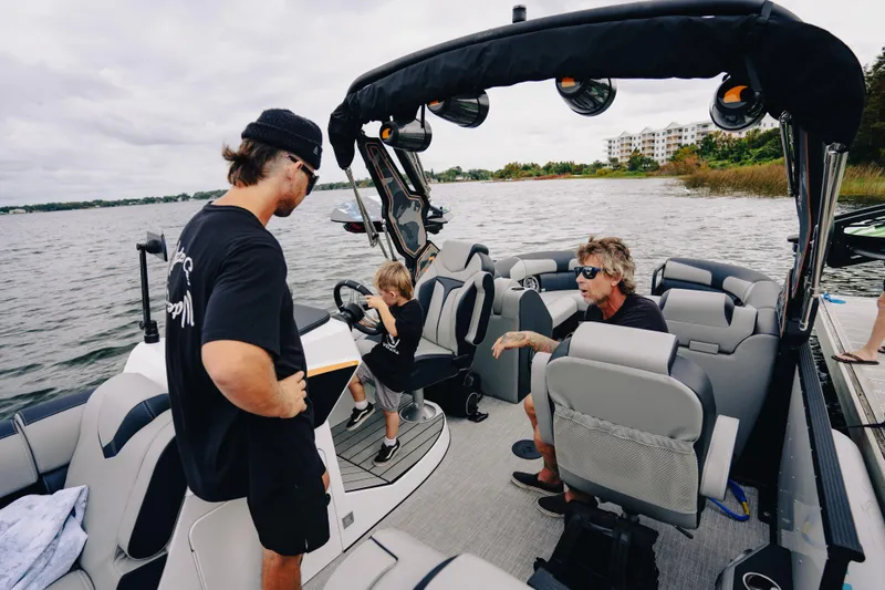 Slide: The Image of 2024 Montara 23 Surf Boss 2.0 CW boat with people enjoying a day on the water. - 8