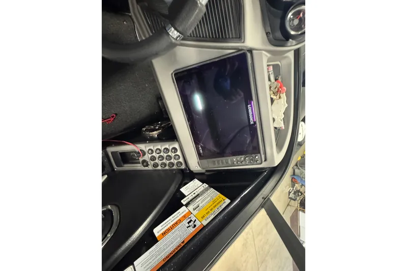 Slide: The Image of Interior of 2021 Ranger 1880MS boat with control panel and display screen. - 10