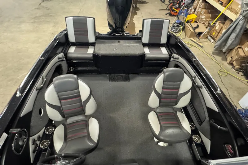 Slide: The Image of 2021 Ranger 1880MS boat interior with four seats, gray and black upholstery. - 12