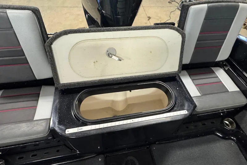 Slide: The Image of 2021 Ranger 1880MS boat interior with open storage compartment and seating. - 16