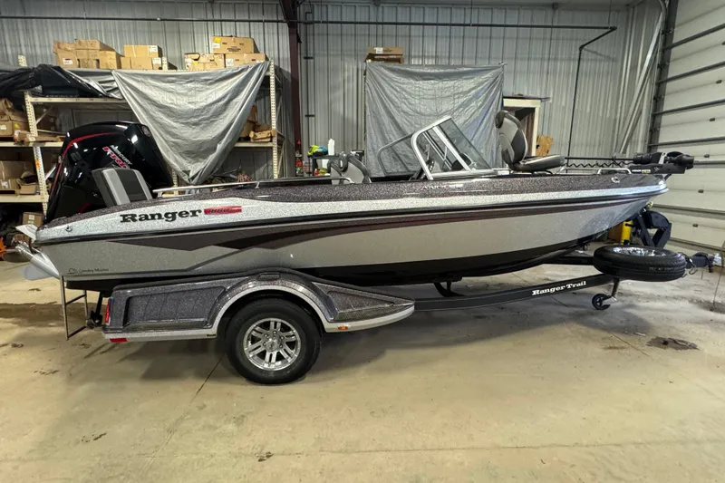 Slide: The Image of 2021 Ranger 1880MS boat in a garage, on a trailer, side view. - 3