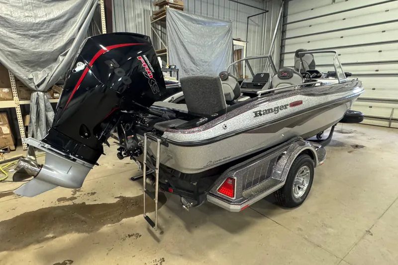 Slide: The Image of 2021 Ranger 1880MS boat with powerful outboard motor in a garage setting. - 4