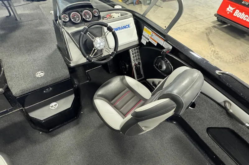 Slide: The Image of Interior of a 2021 Ranger 1880MS boat with steering wheel and control panel. - 8
