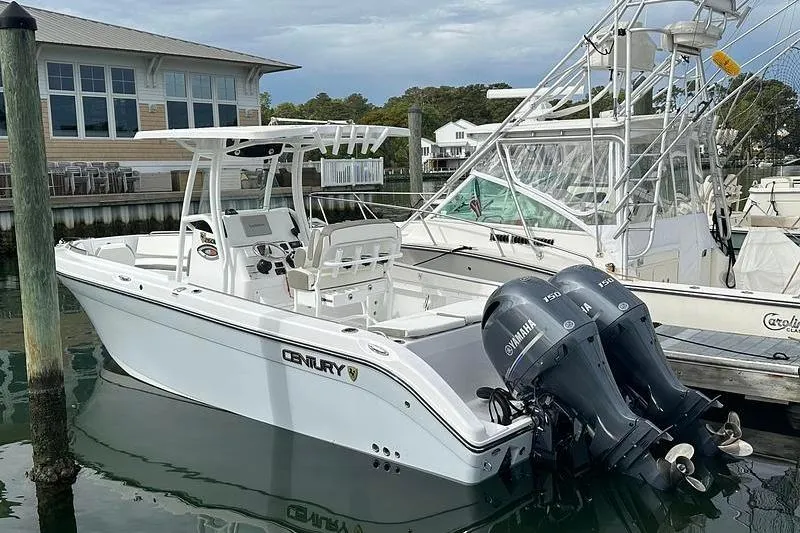 The Image of 2023 Century 2600 Center Console boat docked with twin Yamaha engines. - 0